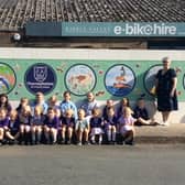 Eye catching artwork has been created by talented youngsters at Thorneyholme RC Primary School to hide an an old garage site that will be developed into a community hub.