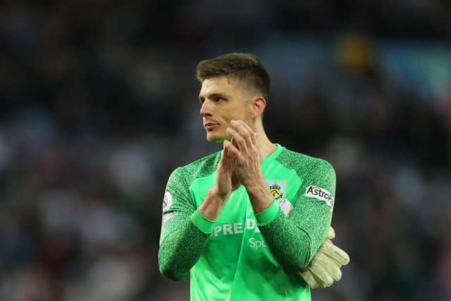 Burnley's English goalkeeper Nick Pope applauds at the end of the English Premier League football match between Aston Villa and Burnley at Villa Park in Birmingham, central England on May 19, 2022. - RESTRICTED TO EDITORIAL USE. No use with unauthorized audio, video, data, fixture lists, club/league logos or 'live' services. Online in-match use limited to 120 images. An additional 40 images may be used in extra time. No video emulation. Social media in-match use limited to 120 images. An additional 40 images may be used in extra time. No use in betting publications, games or single club/league/player publications. (Photo by Geoff Caddick / AFP) / RESTRICTED TO EDITORIAL USE. No use with unauthorized audio, video, data, fixture lists, club/league logos or 'live' services. Online in-match use limited to 120 images. An additional 40 images may be used in extra time. No video emulation. Social media in-match use limited to 120 images. An additional 40 images may be used in extra time. No use in betting publications, games or single club/league/player publications. / RESTRICTED TO EDITORIAL USE. No use with unauthorized audio, video, data, fixture lists, club/league logos or 'live' services. Online in-match use limited to 120 images. An additional 40 images may be used in extra time. No video emulation. Social media in-match use limited to 120 images. An additional 40 images may be used in extra time. No use in betting publications, games or single club/league/player publications. (Photo by GEOFF CADDICK/AFP via Getty Images)