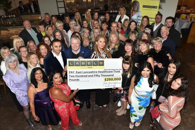 Guests at the ladies' day event, organised by CARES charity and held at Burnley's Penny Black, with the cheque for £250,000 to purchase vital equipment for the ELHT