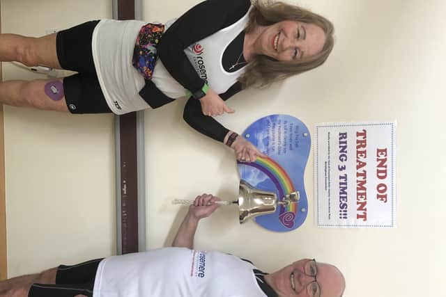 Andy Evenson with his wife Donna, ringing the end of treatment bell on finishing his course of radiotherapy at Rosemere Cancer Centre
