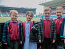 Burnley and Pendle pupils completing Maths challenges at Turf Moor.