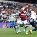 LONDON, ENGLAND - MAY 15: Ryan Sessegnon of Tottenham Hotspur is challenged by Connor Roberts of Burnley during the Premier League match between Tottenham Hotspur and Burnley at Tottenham Hotspur Stadium on May 15, 2022 in London, England. (Photo by Ryan Pierse/Getty Images)