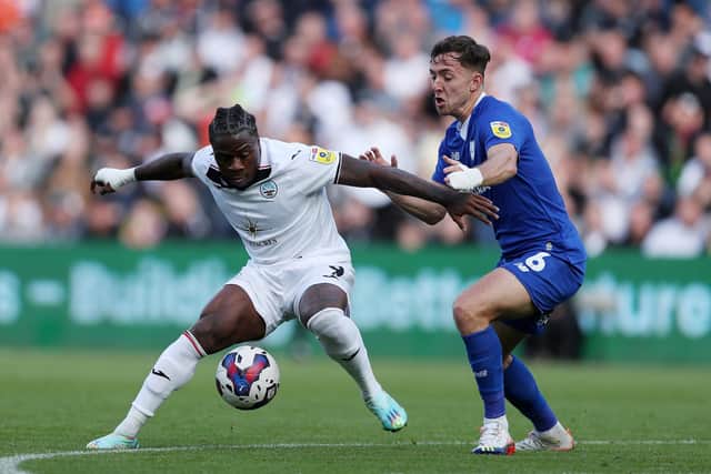 SWANSEA, WALES - OCTOBER 23: Michael Obafemi of Swansea City is challenged by Ryan Wintle of Cardiff City during the Sky Bet Championship between Swansea City and Cardiff City at Liberty Stadium on October 23, 2022 in Swansea, Wales. (Photo by Ryan Hiscott/Getty Images)