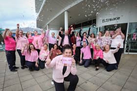 Staff at Boundary Outlet Colne have raised almost £30,000 for breast cancer charities.