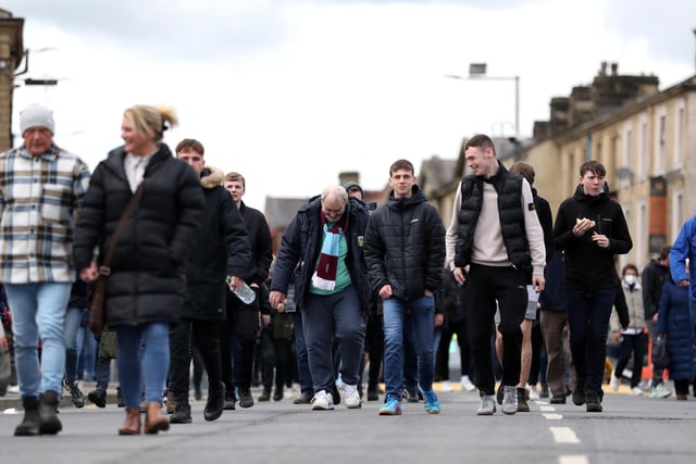 BURNLEY, ENGLAND - APRIL 02: Burnley fans arrive to the stadium prior to the Premier League match between Burnley and Manchester City at Turf Moor on April 02, 2022 in Burnley, England. (Photo by Jan Kruger/Getty Images)
