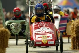 Contestants negotiate a course during The Red Bull Soap Box Race.  (Photo by Bruno Vincent/Getty Images)
