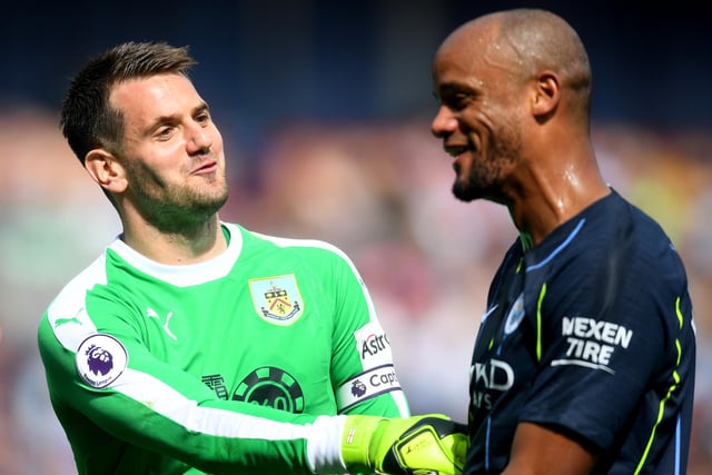 BURNLEY, ENGLAND - APRIL 28:  Vincent Kompany and Tom Heaton of Burnley in discussion during the Premier League match between Burnley FC and Manchester City at Turf Moor on April 28, 2019 in Burnley, United Kingdom. (Photo by Michael Regan/Getty Images)