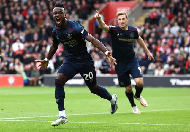 SOUTHAMPTON, ENGLAND - OCTOBER 23:  Maxwel Cornet of Burnley celebrates after scoring his teams first goal during the Premier League match between Southampton and Burnley at St Mary's Stadium on October 23, 2021 in Southampton, England. (Photo by Ryan Pierse/Getty Images)