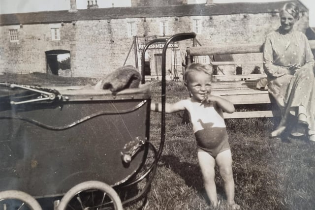 This is another image sent in by Morecambe Visitor reader Julie Holmes, this time from 1935 and shows her in front of Heysham head swings and cafe