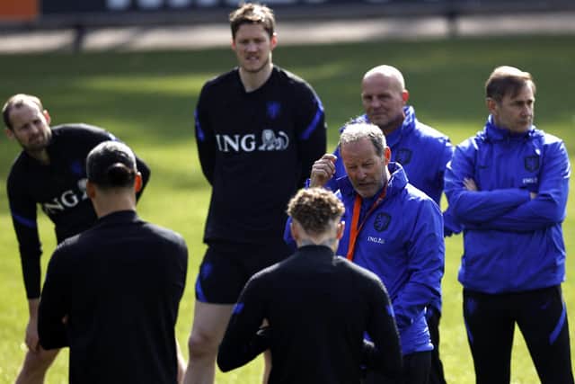 (From L) Netherlands' midfielder Daley Blind forward Wout Weghorst, physical trainer Rene Wormhoudt, assistant coach Danny Blind, and goalkeeper coach Frans Hoek  attend a  training session at the KNVB Campus on March 22, 2022, in Zeist, ahead of friendly football matches against Denmark and Germany - - Netherlands OUT (Photo by MAURICE VAN STEEN / ANP / AFP) / Netherlands OUT (Photo by MAURICE VAN STEEN/ANP/AFP via Getty Images)