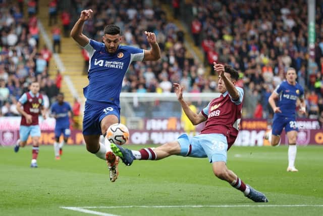 BURNLEY, ENGLAND - OCTOBER 07: Armando Broja of Chelsea battles for possession with Ameen Al-Dakhil of Burnley  during the Premier League match between Burnley FC and Chelsea FC at Turf Moor on October 07, 2023 in Burnley, England. (Photo by George Wood/Getty Images)