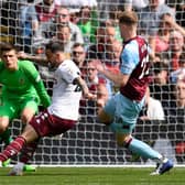 Aston Villa's English striker Danny Ings scores the opening goal during the English Premier League football match between Burnley and Aston Villa at Turf Moor in Burnley, north west England on May 7, 2022.