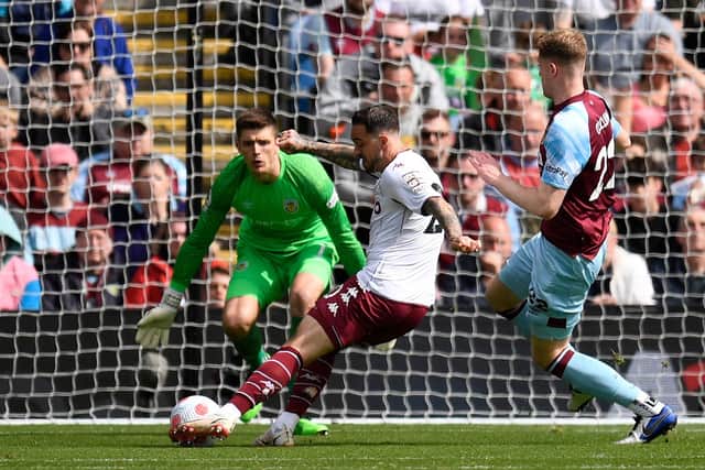 Aston Villa's English striker Danny Ings scores the opening goal during the English Premier League football match between Burnley and Aston Villa at Turf Moor in Burnley, north west England on May 7, 2022.