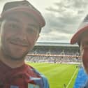 Burnley fans Jack Smith (left) with his dad Jeff. Jack organised a coach to take fans to the away friendly at Genk in Belgium and fans were so appreciative they had a whup round and raised £200 which Jack donated to the Burnley FC in the Community Foodbank