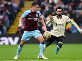 BURNLEY, ENGLAND - FEBRUARY 13: (THE SUN OUT, THE SUN ON SUNDAY OUT) Mohamed Salah of Liverpool competing with Ashley Westwood of Burnley during the Premier League match between Burnley and Liverpool at Turf Moor on February 13, 2022 in Burnley, England. (Photo by Andrew Powell/Liverpool FC via Getty Images)