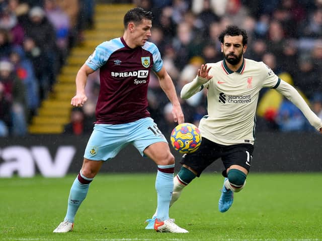 BURNLEY, ENGLAND - FEBRUARY 13: (THE SUN OUT, THE SUN ON SUNDAY OUT) Mohamed Salah of Liverpool competing with Ashley Westwood of Burnley during the Premier League match between Burnley and Liverpool at Turf Moor on February 13, 2022 in Burnley, England. (Photo by Andrew Powell/Liverpool FC via Getty Images)