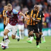BURNLEY, ENGLAND - AUGUST 16: Charlie Taylor of Burnley is challenged by Oscar Estupinan of Hull City during the Sky Bet Championship between Burnley and Hull City at Turf Moor on August 16, 2022 in Burnley, England. (Photo by Clive Brunskill/Getty Images)