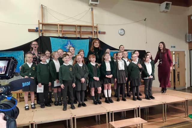 The Duchess of York with the choir at Padiham Green Primary School this morning at the start of her visit to Padiham and Burnley