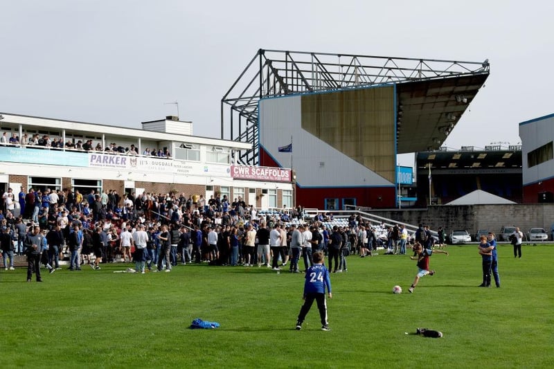 BURNLEY, ENGLAND - OCTOBER 07: General view outside the stadium as fans are seen playing football at Burnley Cricket Club prior to the Premier League match between Burnley FC and Chelsea FC at Turf Moor on October 07, 2023 in Burnley, England. (Photo by George Wood/Getty Images)