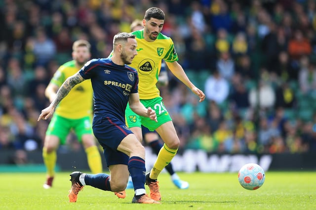 NORWICH, ENGLAND - APRIL 10: Josh Brownhill of Burnley makes a pass whilst under pressure from Pierre Lees Melou of Norwich City during the Premier League match between Norwich City and Burnley at Carrow Road on April 10, 2022 in Norwich, England. (Photo by Stephen Pond/Getty Images)