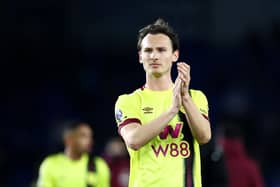 BRIGHTON, ENGLAND - DECEMBER 09: Hjalmar Ekdal of Burnley acknowledges the fans following the Premier League match between Brighton & Hove Albion and Burnley FC at American Express Community Stadium on December 09, 2023 in Brighton, England. (Photo by Bryn Lennon/Getty Images)