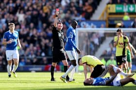 LIVERPOOL, ENGLAND - APRIL 06: Referee Michael Oliver gives a red card to Dara O'Shea of Burnley during the Premier League match between Everton FC and Burnley FC at Goodison Park on April 06, 2024 in Liverpool, England. (Photo by Jan Kruger/Getty Images) (Photo by Jan Kruger/Getty Images)