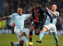 Paris Saint-Germain's French forward Péguy Luyindula (C) vies with Manchester City's Irish midfielder Stephen Ireland (R) and Manchester City's Belgian defender Vincent Kompany during their UEFA Cup group A football match at the City of Manchester stadium, in Manchester, north-west England, on December 3 2008. AFP PHOTO/ANDREW YATES (Photo credit should read ANDREW YATES/AFP via Getty Images)