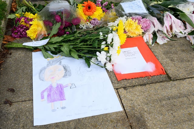 Several floral tributes, cards and messages to The Queen were left at the War Memorial in the Peace Gardens in Burnley