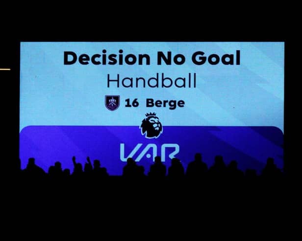 NOTTINGHAM, ENGLAND - SEPTEMBER 18: The LED screen displays the VAR decision of 'No Goal - Handball' for the goal scored by Lyle Foster of Burnley (not pictured) during the Premier League match between Nottingham Forest and Burnley FC at City Ground on September 18, 2023 in Nottingham, England. (Photo by Marc Atkins/Getty Images)