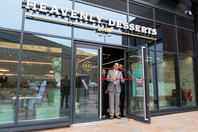 The Mayor of Burnley Coun. Raja Arif Khan officially opens Heavenly Desserts at Pioneer Place in Burnley with co-owners Sannah and Daoud. Photo: Kelvin Lister-Stuttard