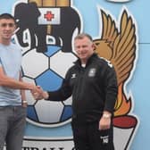 Thomas pictured with Sky Blues boss Mark Robins. Picture: Coventry City FC