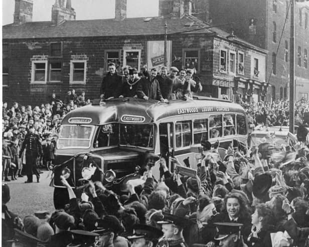 Burnley FC players arrive home to a resounding welcome from fans after narrowly losing the FA Cup Final to Charlton Athletic in April 1947.