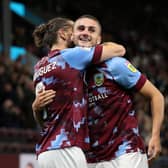 BURNLEY, ENGLAND - AUGUST 30: Taylor Harwood-Bellis of Burnley celebrates with goal scorer Jay Rodriguez during the Sky Bet Championship between Burnley and Millwall at Turf Moor on August 30, 2022 in Burnley, England. (Photo by Alex Livesey/Getty Images)