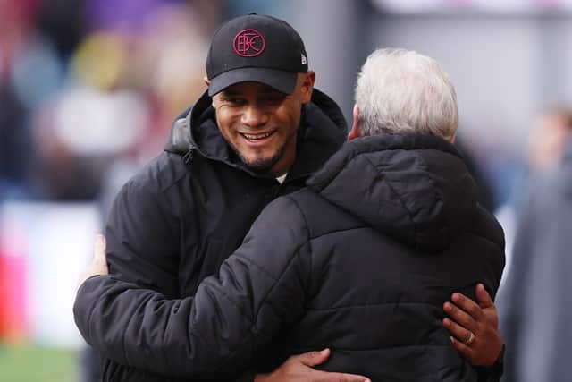 BURNLEY, ENGLAND - NOVEMBER 04: Vincent Kompany, Manager of Burnley, and Roy Hodgson, Manager of Crystal Palace, embrace prior to the Premier League match between Burnley FC and Crystal Palace at Turf Moor on November 04, 2023 in Burnley, England. (Photo by Nathan Stirk/Getty Images)