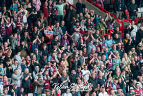 Burnley fans goad Blackburn Rovers supporters with 'mind the gap' banner. Photo: Kelvin Stuttard