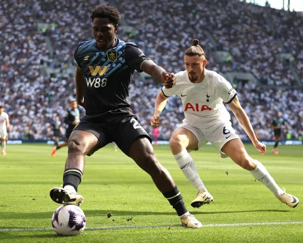 LONDON, ENGLAND - MAY 11: Datro Fofana of Burnley controls the ball under pressure from Radu Dragusin of Tottenham Hotspur during the Premier League match between Tottenham Hotspur and Burnley FC at Tottenham Hotspur Stadium on May 11, 2024 in London, England. (Photo by Julian Finney/Getty Images)