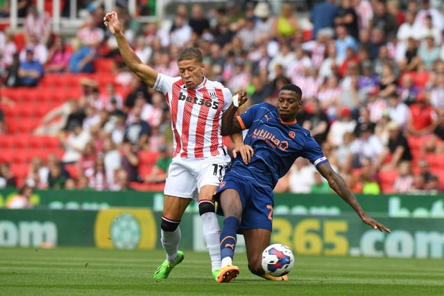 STOKE ON TRENT, ENGLAND - AUGUST 06: Dwight Gayle (L) of Stoke City is challenged by Marvin Ekpiteta of Blackpool during the Sky Bet Championship match between Stoke City and Blackpool at Bet365 Stadium on August 06, 2022 in Stoke on Trent, England. (Photo by Tony Marshall/Getty Images)