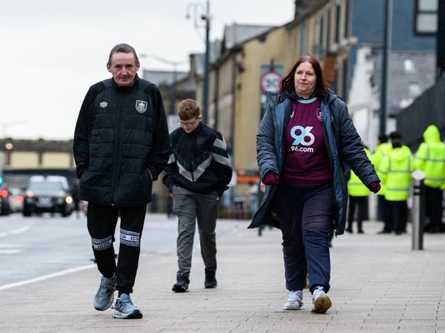 Burnley fans arrive at Turf Moor for the Premier League fixture against West Ham United. Photo: Kelvin Lister-Stuttard