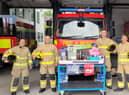 Crews at Burnley Fire Station with some of the prizes up for grabs at the open day next Saturday