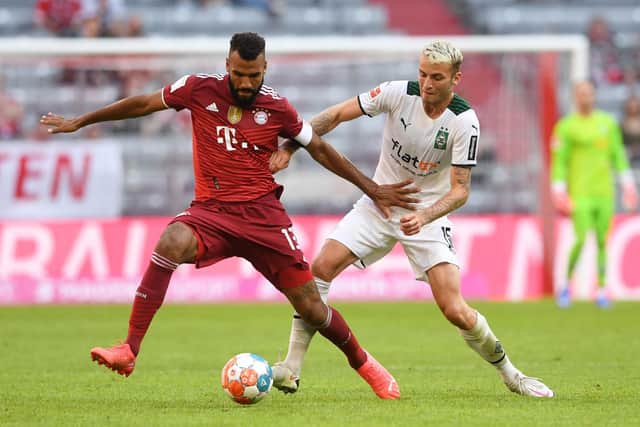 Bayern Munich's Cameroonian forward Eric Maxim Choupo-Moting (L) and Moenchengladbach's German defender Louis Jordan Beyer (R) vie for the ball during the Audi Summer Tour 2021 football match FC Bayern Munich v Borussia Moenchengladbach in Munich, southern Germany, on July 28, 2021. (Photo by Christof STACHE / AFP) (Photo by CHRISTOF STACHE/AFP via Getty Images)