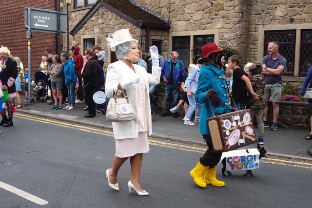 Paddington, Queen and corgi taking part in the parade