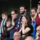 BURNLEY, ENGLAND - MAY 22: Burnley fans looks dejected following defeat and relegation to the Sky Bet Championship following the Premier League match between Burnley and Newcastle United at Turf Moor on May 22, 2022 in Burnley, England. (Photo by Gareth Copley/Getty Images)