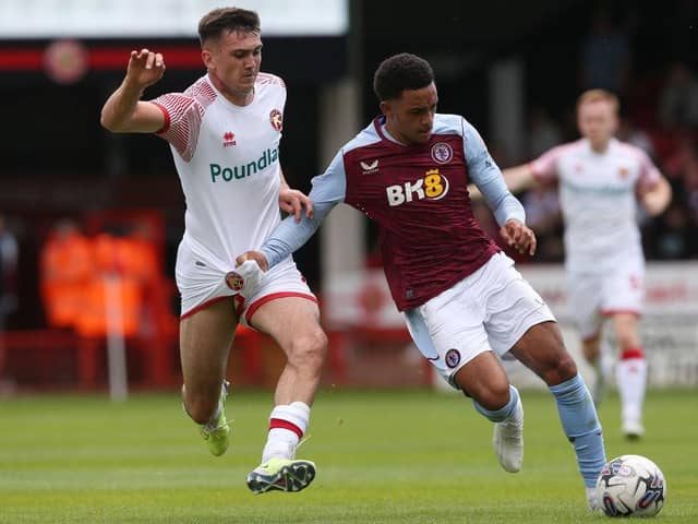 WALSALL, ENGLAND - JULY 15: Oisin McEntee of Walsall  and Aaron Ramsey of Aston Villa battle for the ball during the pre-season friendly match between Walsall  and Aston Villa at Poundland Bescot Stadium on July 15, 2023 in Walsall, United Kingdom. (Photo by Barrington Coombs/Getty Images)