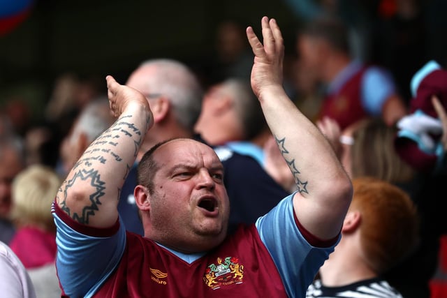 BURNLEY, ENGLAND - MAY 22: A fan shows his support during the Premier League match between Burnley and Newcastle United at Turf Moor on May 22, 2022 in Burnley, England. (Photo by Jan Kruger/Getty Images)