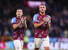 BURNLEY, ENGLAND - AUGUST 30: Taylor Harwood-Bellis and Josh Cullen of Burnley applaud their support after the Sky Bet Championship between Burnley and Millwall at Turf Moor on August 30, 2022 in Burnley, England. (Photo by Alex Livesey/Getty Images)