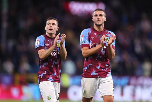 BURNLEY, ENGLAND - AUGUST 30: Taylor Harwood-Bellis and Josh Cullen of Burnley applaud their support after the Sky Bet Championship between Burnley and Millwall at Turf Moor on August 30, 2022 in Burnley, England. (Photo by Alex Livesey/Getty Images)