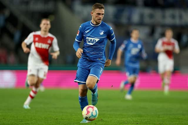 COLOGNE, GERMANY - OCTOBER 30: Jacob Bruun Larsen of Hoffenheim runs with the ball during the Bundesliga match between 1. FC Köln and TSG Hoffenheim at RheinEnergieStadion on October 30, 2022 in Cologne, Germany. (Photo by Lars Baron/Getty Images)
