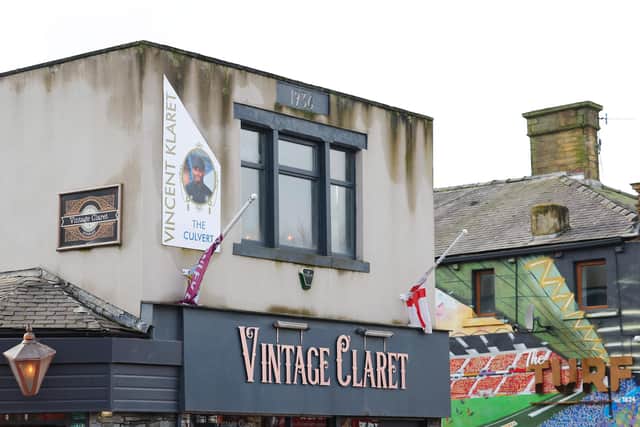 BURNLEY, ENGLAND - FEBRUARY 17: An image of Vincent Kompany, Manager of Burnley, is seen on the side of the Vintage Claret pub with the text 'Vincent Klaret' outside the stadium prior to the Premier League match between Burnley FC and Arsenal FC at Turf Moor on February 17, 2024 in Burnley, England. (Photo by Matt McNulty/Getty Images)