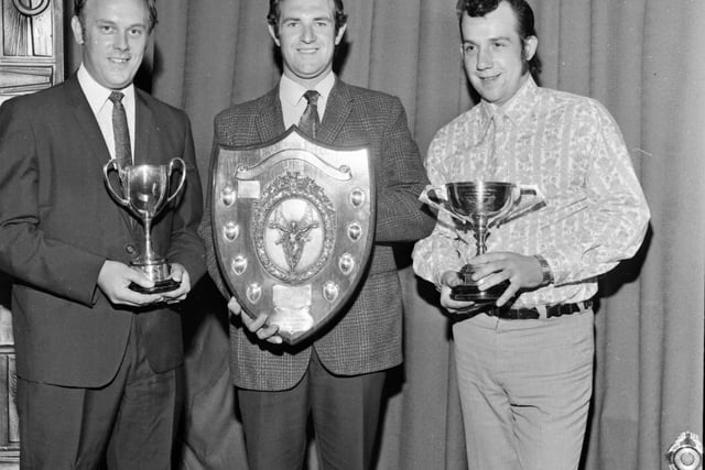 The snooker and darts section of the Works Sports and Welfare Association had their annual prizegiving at the Bank Hall Miners' Institute on Thursday 24th June 1971. Three of the winning captains and the trophies: D. Burrows (Prestige), R. Beaumont (Bank Hall), J. Howard (Bass Charrington).