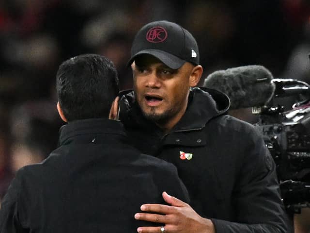 Arsenal's Spanish manager Mikel Arteta (L) and Burnley's Belgian manager Vincent Kompany (R) embrace on the final whistle in the English Premier League football match between Arsenal and Burnley at the Emirates Stadium in London on November 11, 2023. Arsenal won the game 3-1. (Photo by Glyn KIRK / AFP) / RESTRICTED TO EDITORIAL USE.